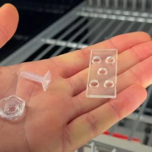 Plastic mounting elements for Adapter-T Rails A049 and A051 on wire shelves
